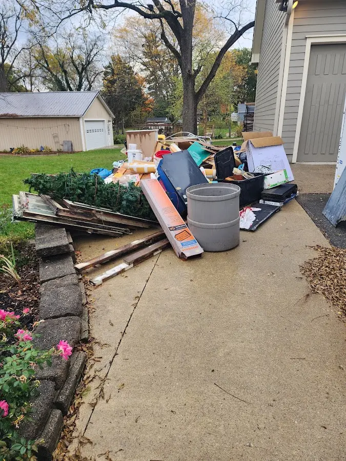 Dumpster being loaded with debris for Residential Dumpster Rental in Mango